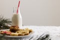 Bottle of milk, christmas cookies and copy space on white background Royalty Free Stock Photo