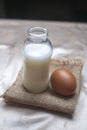 A bottle of milk and an egg