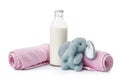 Bottle of milk with towels and toy on white background Royalty Free Stock Photo