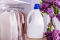 bottle mockup with detergent against the background of a closet with clothes Royalty Free Stock Photo
