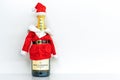 Bottle of Moet & Chandon champagne in santa claus costume isolated on white background. New Year and Christmas concept. Russia,