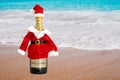 Bottle of Moet Chandon champagne in santa claus costume by the sea. New Year and Christmas concept. Russia, Tatarstan, October 12