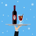 Bottle of mulled wine and glass on tray on blue background Royalty Free Stock Photo