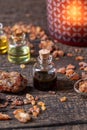 A bottle of myrrh essential oil with myrrh resin Royalty Free Stock Photo