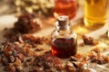 A bottle myrrh essential oil with myrrh resin Royalty Free Stock Photo