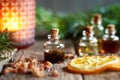 A bottle of myrrh essential oil with myrrh resin, orange and fir in the background Royalty Free Stock Photo