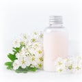 A bottle of natural baby cosmetic with flowers