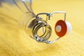 Bottle neck close up. Macro image of a bottle with an open cap on yellow with a shallow depth of field Royalty Free Stock Photo