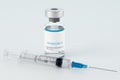 Bottle with a new, modern single-component vaccine against the coronavirus CAVID-19 SARS-CoV-2. A syringe filled with an