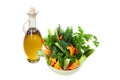 The bottle of olive oil and bowl of fresh vegetables Royalty Free Stock Photo