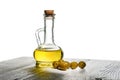 bottle with olive oil and a few olives on a white background with copy space Royalty Free Stock Photo