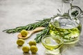 Bottle with olive oil and herbs on stone background mockup Royalty Free Stock Photo