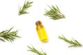 A bottle of olive oil and rosemary twigs on a white background Royalty Free Stock Photo