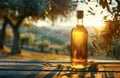 A bottle of olive oil stands on a rustic wooden table Royalty Free Stock Photo