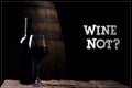 Wine Not. A bottle opf red wine and a glass with barrel on background