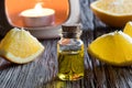 A bottle of orange essential oil with an aroma lamp Royalty Free Stock Photo