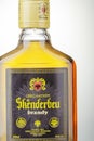 Bottle of original albanian brandy Skenderbeu on gradient background. Royalty Free Stock Photo