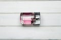 A bottle package of pink BOSS Femme fragrance for women by Hugo Boss