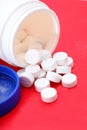 Bottle of paracetamol on red tablets. Royalty Free Stock Photo