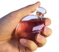 Bottle of parfume in hand Royalty Free Stock Photo