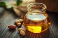A bottle of peanut oil sitting next to a handful of peanuts Royalty Free Stock Photo