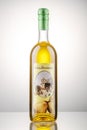 Bottle of pear flavored rakija isolated on gradient background produced in Omis, Croatia.