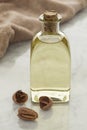 Bottle with pecan oil Royalty Free Stock Photo