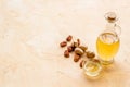 Bottle of pecan oil with nuts on the table, close up Royalty Free Stock Photo