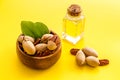 Bottle of pecan oil with nuts on the table, close up Royalty Free Stock Photo