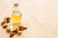 Bottle of pecan oil with nuts on the table, close up Royalty Free Stock Photo