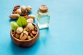 Bottle of pecan oil with nuts on the table, close up Royalty Free Stock Photo