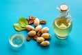 Bottle of pecan oil with nuts on the table, close up Royalty Free Stock Photo