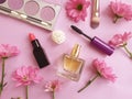 Bottle perfume, decorative cosmetics, flower on a colored background Royalty Free Stock Photo