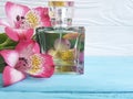 Bottle of perfume flower alstroemeria beautiful on a wooden background