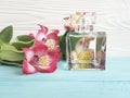 Bottle of perfume flower alstroemeria decoration beautiful on a wooden background