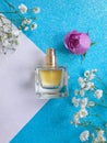 Bottle perfume flower fragrance aroma on a colored background feminine