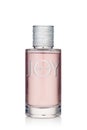 Bottle of perfume Joy on white background. Christian Dior