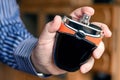 Bottle of perfume in a man`s hand Royalty Free Stock Photo