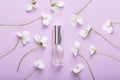 Bottle of perfume on pancy flowers. Flower fresh scent. Royalty Free Stock Photo