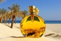 A bottle of perfume on the seashore is enveloped in a wave. Yellow sand on the beach, marine cosmetics and fragrance Royalty Free Stock Photo