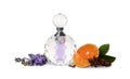 Bottle of perfume, tangerine, flowers and spices on white background Royalty Free Stock Photo
