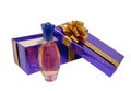 Bottle of perfume on violet box over white background Royalty Free Stock Photo