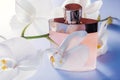 Bottle of perfume with white orchid Royalty Free Stock Photo