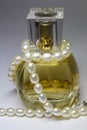 Bottle of perfumes and pearl Royalty Free Stock Photo