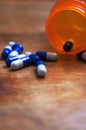 Bottle of Pharmaceutical Pills on a table.