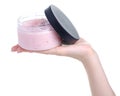 Bottle pink scrub for body in hand