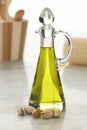 Bottle with pistachio oil and unshelled nuts Royalty Free Stock Photo