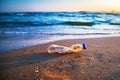 Bottle plastic on stone ground show long life garbage concept Royalty Free Stock Photo