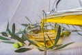 Bottle pouring virgin extra olive oil in a bowl Royalty Free Stock Photo