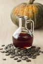 Bottle with pumpkin seed oil and roasted seeds Royalty Free Stock Photo